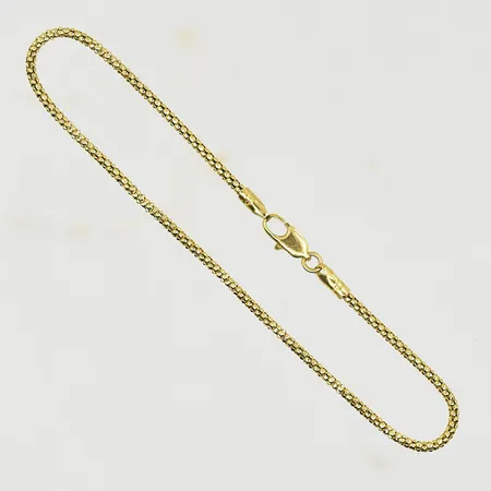 Armband, längd 17½ cm, bredd 1 mm, ojämn länk, 18K. Vikt: 1,8 g