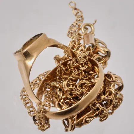 Diverse defekt guld, 18K, vikt 21,95g.