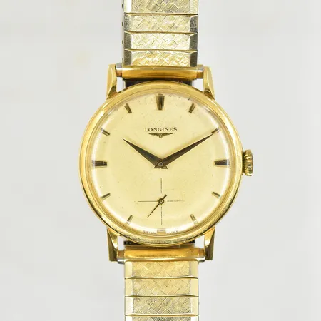 Herrur Longines 18K, boett Ø34 mm, manuell, ref 6983-23, serienr 11834920, ca 1960-tal, troligen utbytt krona, flexband i doublé, graverad bakboett, fungerade vid testtillfället, bruttovikt 59,4g