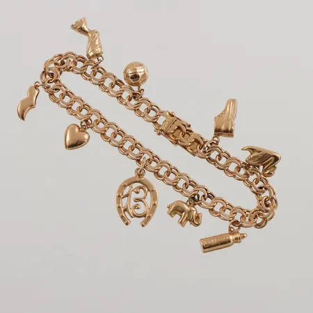 Armband Bismarck, 19cm, bredd: 6,8mm, 9 berlocker, 18K, 20,7g.