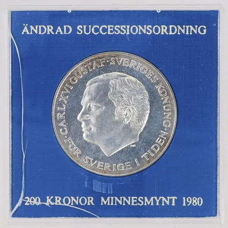 Minnesmynt 200kr, Ändrad successionsordning 1980, 925/1000 silver. Plastetui med spricka. Vikt: 27 g
