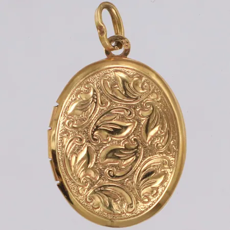 Hänge medaljong, längd 26,8mm, bredd 16,4mm, öppningsbar med plats för fotografi, 18K  Vikt: 2,8 g