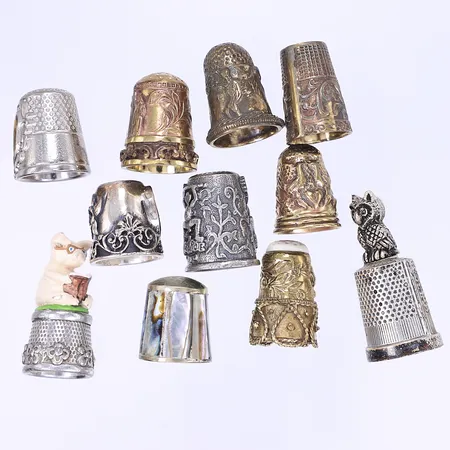 11 Fingerborgar av olika material oädel metall 1900-tal