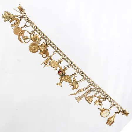 Armband Bismarck med berlocker: 15st i 18K samt 4st i 14K, längd: 19cm, bredd: 5,5mm, M. K:S Guldsmedsatelier AB, Stockholm 1960, en länkbit deformerad, 18K & 14K guld Vikt: 33,7 g