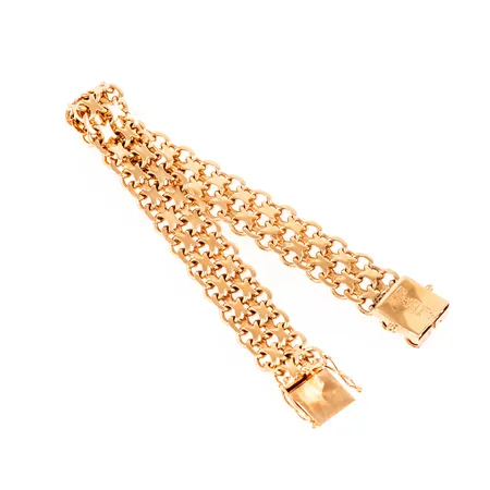Armband X-länk i 18K guld. Det är 18 cm långt, 12 mm brett och väger 28,2g. Kistlås. Stämplad S9 (1968), BHG (Bröderna Hedens Guldsmeds AB, Ängelholm), 18K och kattfot. 