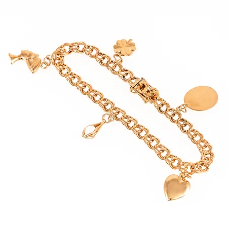 Armband Bismarck i 18K guld med fem berlocker. Det är 20 cm långt, 6 mm brett och väger 18,5g. Kistlås. 