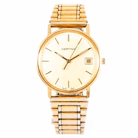 Herrur Certina i 18K guld med nött doubléband. Boett Ø 33,5 mm med gravyr. Repigt plastglas. Quartz- går ej- batteribyte krävs?