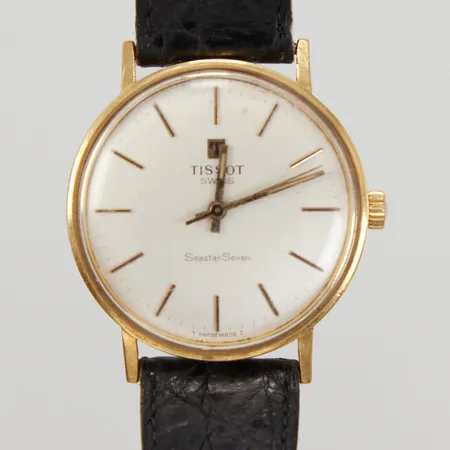 Herrur Tissot Seastar Seven 18K, manuell, Ø 33,5mm, defekt/går ej, gravyr, slitet läderarmband