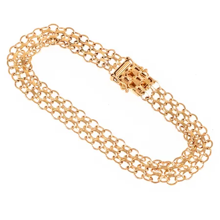 Armband X-länk i 18K guld. Det är 19 cm långt, 8,5 mm brett och väger 9,0g. Kistlås. 