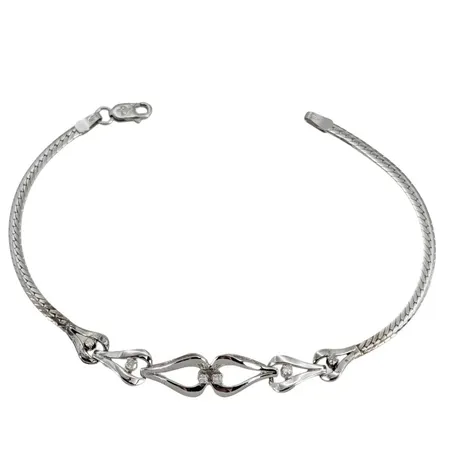 Armband, 18K vitguld, Diamanter 6 x 0,02 - 0,03ct, Balestra Italien, längd 21,0 cm, bredd 2,5 - 9 mm, två lödningar har släppt, för övrigt i fint skick Vikt: 9,5 g