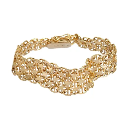 Armband X-länk med stav, 18K guld, treradig modell, Nils-Olofs Guldsmedja (NGB), Stockholm, svensk kontrollstämpel, längd knäppt 18,5 cm, bredd 16 mm, fint skick Vikt: 31,3 g