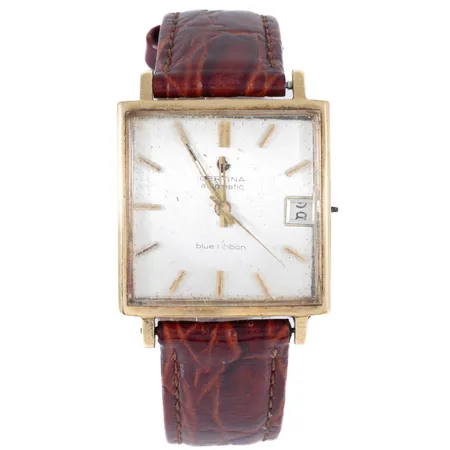 Defekt herrur Certina Blue Ribbon Automatic i 18K guld. Boett 29 x 29 mm, automatiskt urverk, datum, gravyr, krona saknas, fläckig urtavla, repigt plexiglas, hack och repor boett. Bruttovikt inkl. läderband 40,2g. 