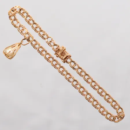 Armband Bismarck en berlock med pärla Ø5,6mm, längd 19cm, bredd 4,5mm, Bengt Hallberg Guldsmeds AB, år 1991, 18K Vikt: 6,9 g