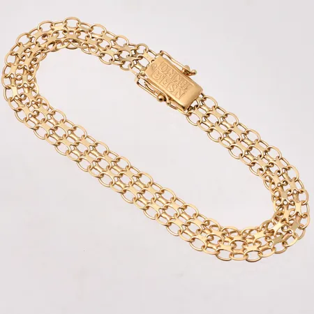 Armband i 18K guld, 18,5cm, X-länk, bredd 7,9mm, tillverkad av NSE Guldvaru Aktiebolag, år 1991, vikt 9,45g.