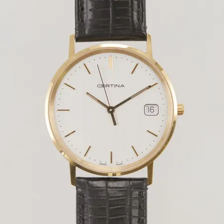 Herrur Certina 18K, 33,5mm, quartz, går ej, läderband.