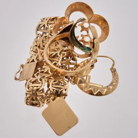 Diverse defekt guld, 18K, vikt 19,14g.