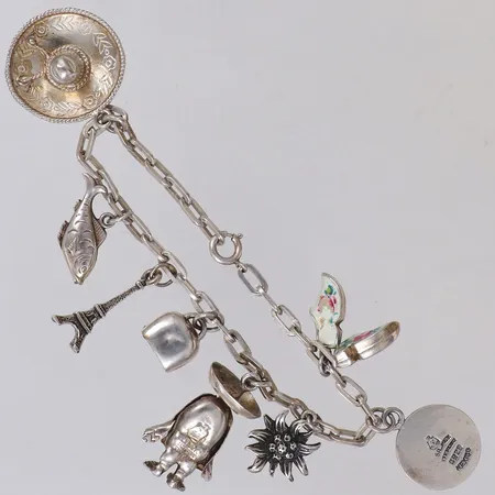 Armband med åtta berlocker, längd 19cm, bredd 3,8mm, 800/1000 silver Vikt: 20,5 g