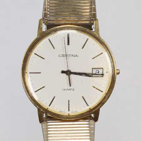 Herrur Certina 18K Ø33,5mm ref nr. EOL115.9199.68, gravyr, monocoque-boett, quartz (går ej), defekt, repigt glas, flexlänk, guld i boett