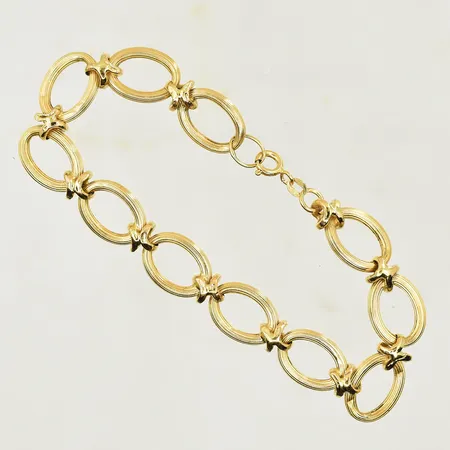 Armband med matt yta, längd 20½ cm, bredd 11 mm, bucklor på länkar, 18K. Vikt: 10,3 g