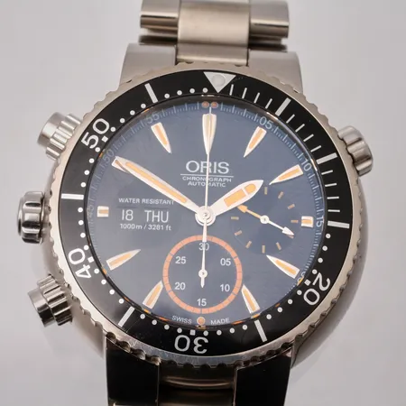Herrur Oris Carlos Coste Limited Edition, titan, Ø7mm, automat, kronograf, heliumventil, safirglas, dag/datum, ref-nr 678 7598 71 84, erie-nr 0057/2000, länk i titan, 1st extra länk, manual. certifikat, original box, ytter kartong.