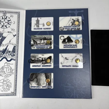 7 guldmynt 2,5 Niue Dollar, Muminmotiv bla Hattifnattarnas Ö och Muminhuset, tillv. Mynthuset, plomberade, i album, med äkthetscertifikat från Mynthuset, 0,5g/st, 24K totalt 3,5g