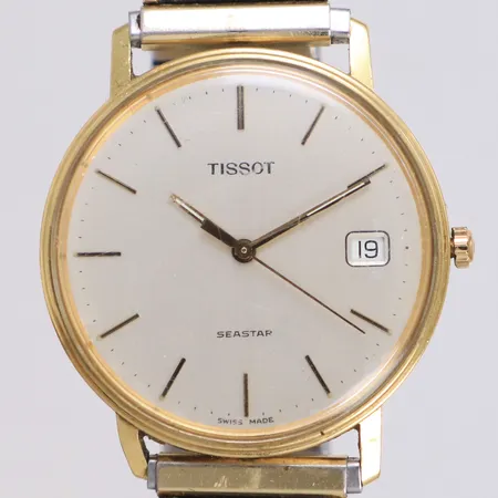 Herrur Tissot Seastar 18K, quartz, 33mm, datum, gravyr, repigt plexiglas, skadat flexarmband ej original, går ej, inga tillbehör.