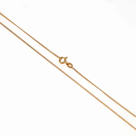 Kedja Pansar i 18K guld. Den är 51 cm lång, 1,2 mm bred och väger 3,0g. Springring.