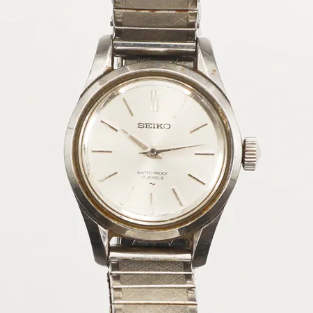 Damur Seiko, Ø23mm, manuell, stål, repigt plexiglas, flexarmband i rostfritt stål, inga övriga tillbehör