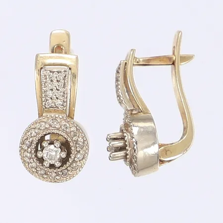 Ett par örhängen med diamanter tot ca 0,30ct Ø10mm 14K Vikt: 7,7 g