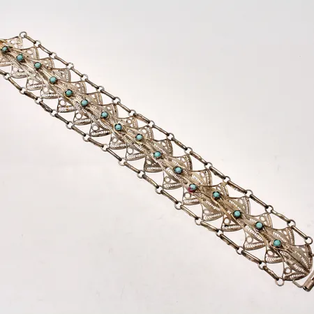 Armband i silver, 19cm, bredd 26,3mm, Fillergran arbete, 17st turkosa stenar, mått Ø3mm, 830/1000, vikt 27,92g.