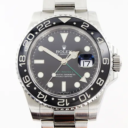 Herrur Rolex GMT-Master II, stål, automatisk, Ø40mm, svart urtavla, modell 116710LN, caliber 3186, verk nr 31734549, boett nr 2360, serie nr M432716, Oyster stållänk 20,5cm, certifikat Bergströms April 2008 Malmö, inga övriga tillbehör. Vikt: 0 g