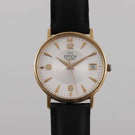 Herrarmbandsur 18k Epoch Stockholm,diameter ca 33.4 mm,batteribyte behövs.originaletui. Vikt: 0 g