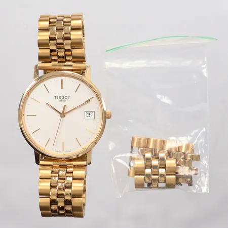 Klocka Tissot, quarts, datum, Ø 33mm, stålarmband med extra länkar, gravyr, boett i 14K.