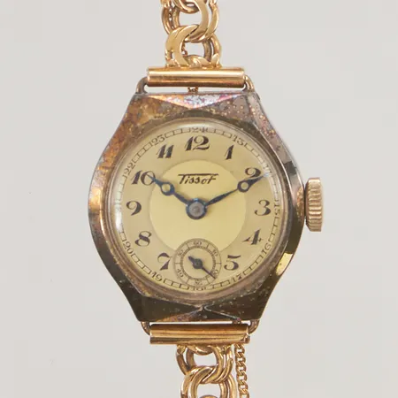 Damur Tissot 14K, 21mm, manuell, bismark i 18K totallängd ca 15,5cm, 18K bruttovikt 16,1g.