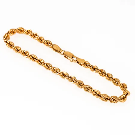 Armband cordel i 18K guld. Det är 19,5 cm långt, 4,3 mm brett och väger 5,0g. Karbinhake.