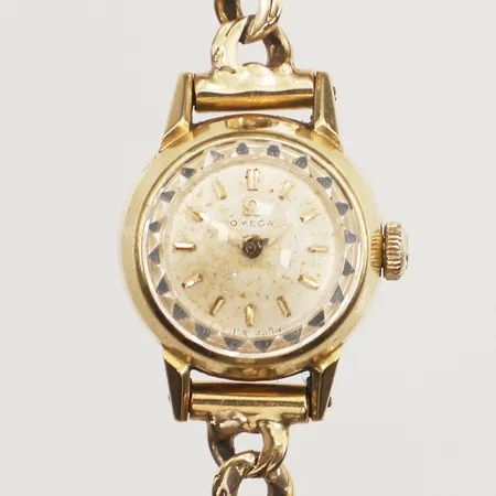 Damur Omega, manuell, Ø17mm, armband Bismarck, längd ca 16cm, saknar säkerhetskedja, 18K bruttovikt: 17,3g   