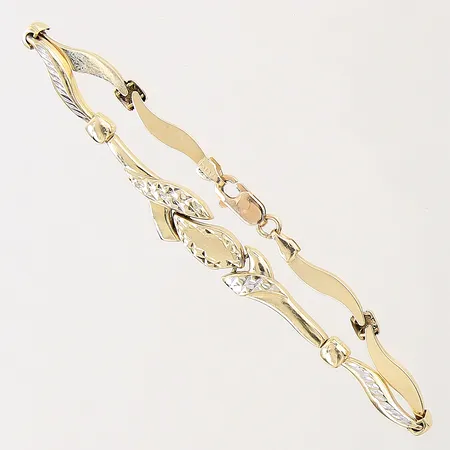 Armband med dekor, längd 17,5cm, bredd 2,7-9mm, smärre bucklor/slitage, tvåfärgat, ostämplat, 18K Vikt: 6,1 g
