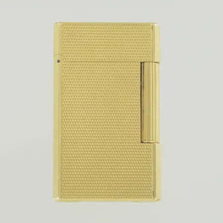 Tändare S.T. Dupont 10EH21 ca 1970-1985 tal, tillverkad i Frankrike bredd 3 cm, höjd 6 cm, guldpläterad. Behov av påfyllning