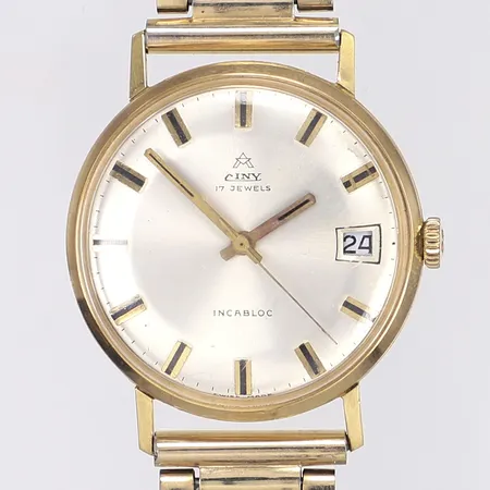Herrur Ciny, Ø34mm, manuell, datum, 18K i boett, armband i dubblé, graverad boett, tickar men ej testad för tidshållning, böjda buckliga bandhorn