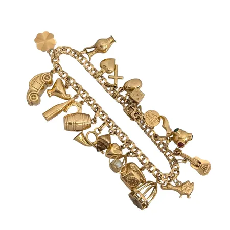 Armband Bismarck med 22 berlocker, 18K guld, defekt, bruttovikt 25,9g Vikt: 25,9 g