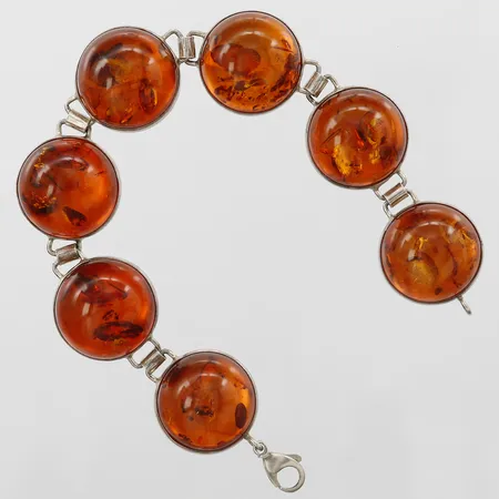 Armband med cabochonslipad bärnsten, längd 20cm, bredd 20mm, otydlig stämpel, silver, bruttovikt 29,91g