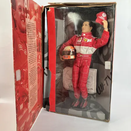 Docka Micahel Schumacher, limited edition, Farrari, "Hot wheels racing collection", med certifikat, skadad kartong Skickas med paket.