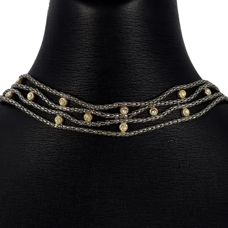 Collier, silver 925/1000, oxiderad ton, vita stenar (förgylld fattning), 4-radig modell, längd 31,5-37,5 cm, bredd ca. 20 mm, fint skick Vikt: 14,6 g