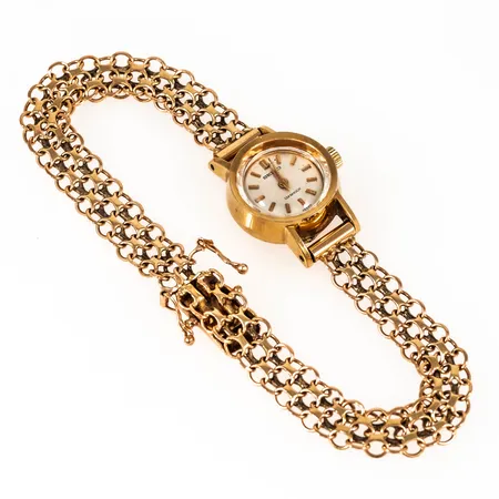 Smyckeur Seiko Diashock i 14K guld med band i 18K. Boett Ø 17 mm, manuell, repigt glas, defekt länk. Bruttovikt: 15,6g.