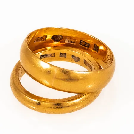 Graverade ringar i 23K guld. Vikt: 14,7g.