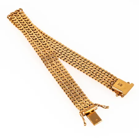 Armband 3-radig pansar i 18K guld. Det är 19 cm långt, 10 mm brett och väger 24,4g. Kistlås.