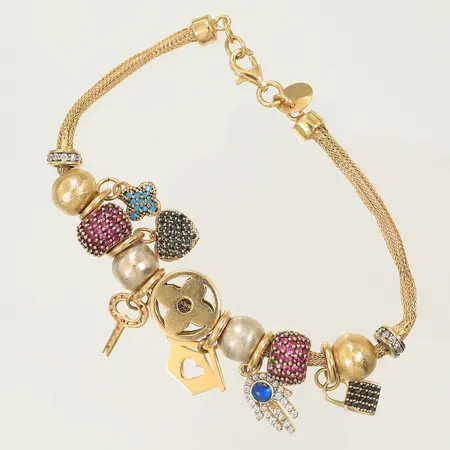 Armband med berlocker ca 18,5cm bredd 3-25mm stenar saknas, bucklig/defekt 21K Bruttovikt 22,4g Vikt: 22,4 g