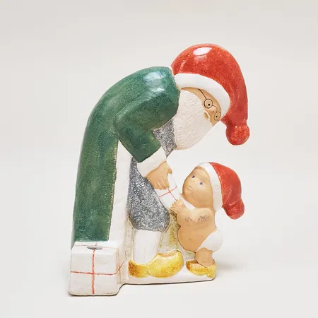 Figurin/Ljusstake Milleniumtomte, Lisa Larson för K-studion Gustavsberg, höjd: 20cm, glaserat stengods, signerad undertill, med plats för ett julgransljus, svarta skavmärken