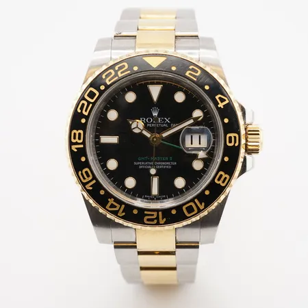 Herrur Rolex GMT Guld/Stål Ref: 116713LN, serienr: V299783, uttagen 2009, box & cert, 12 länkbitar totalt, klockan och länken är repig. Vikt: 0 g