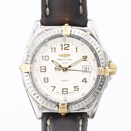 Damur Breitling Wings Lady, stål med guldraiders, quartz, Ø31mm, referensnummer B67050, serienummer 10340, originalarmband, behov av batteribyte, slitage, ytliga repor, läderband med mindre skador, inga tillbehör.